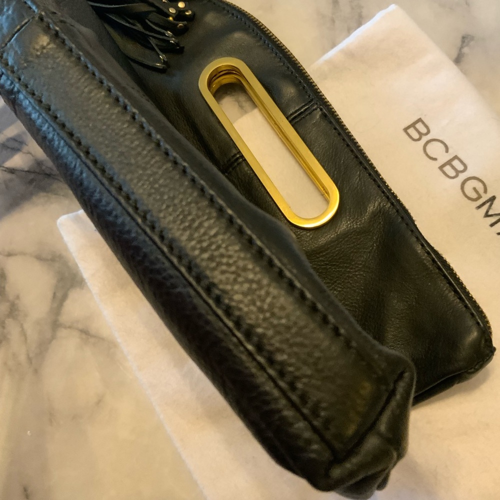 BCBGMaxAzria Black foldable Clutch ,tassel charm with Gold Details. - Picture 10 of 16